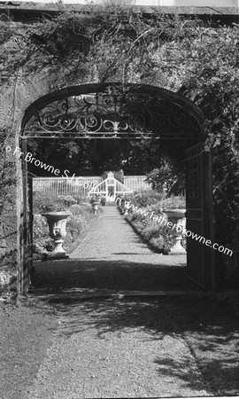 DUNSANY CASTLE GARDEN THROUGH GATE WITH VICTORIA DE RUTZEN AND 